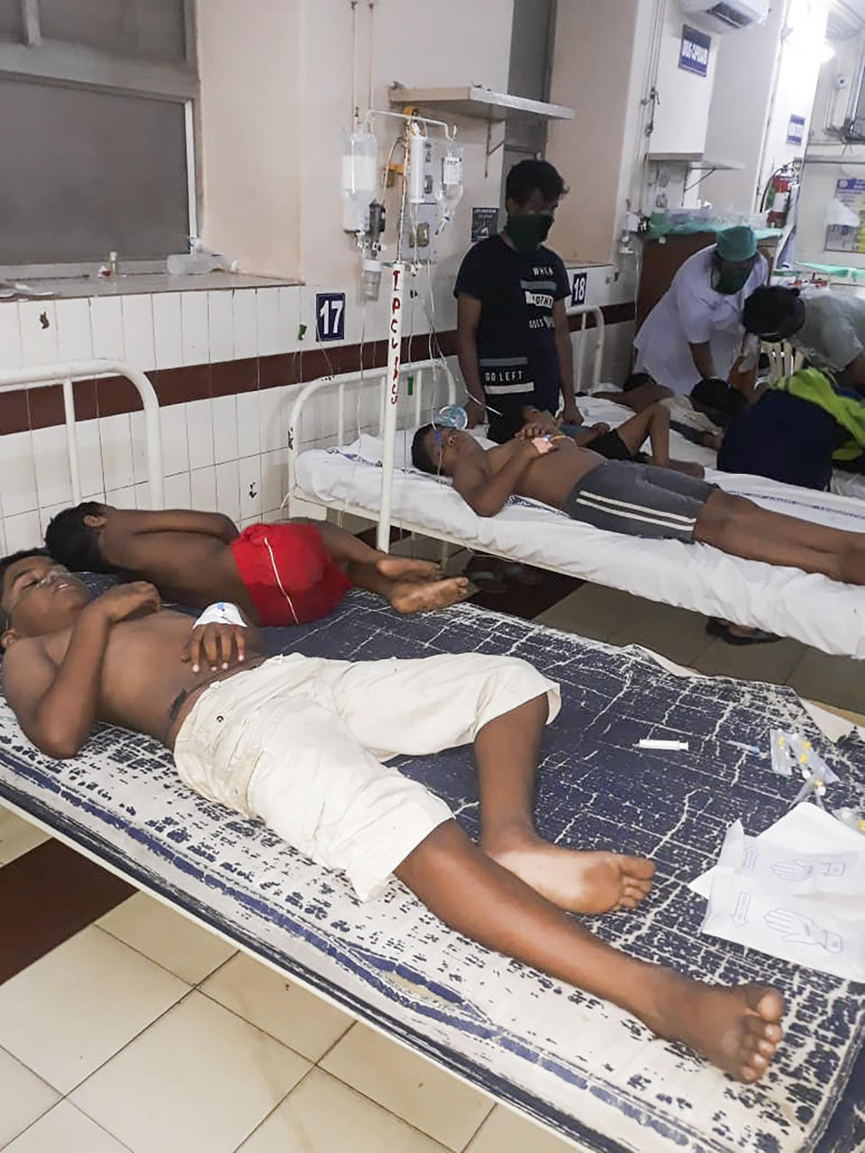 Staff attend to children affected by a gas leak from an LG Polymers plant at the King George hospital in Visakhapatnam on May 7, 2020. - At least five people have been killed and several hundred hospitalised after a gas leak at a chemicals plant on the east coast of India, police said on May 7. They said that the gas had leaked out of two 5,000-tonne tanks that had been unattended due to India's coronavirus lockdown in place since late March. (Photo by - / AFP) (Photo by -/AFP via Getty Images)