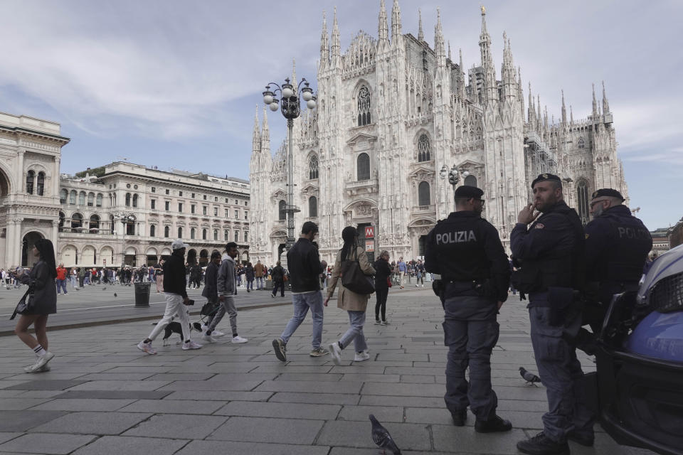 Police patrol in front of Milan gothic cathedral in Milan, Monday, March 25, 2024. Italy followed France Monday in stepping up its security stance following the attack on a suburban Moscow concert hall and the claim of responsibility by an affiliate of the Islamic State group. (AP Photo/Luca Bruno)