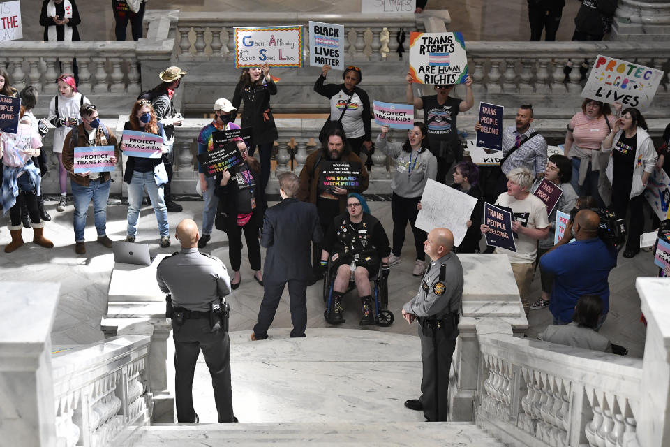 Protesters of Kentucky Senate bill SB150, known as the Transgender Health Bill gather at the steps of the Senate chamber of the Kentucky State Capitol in Frankfort, Ky., Wednesday, March 29, 2023. (AP Photo/Timothy D. Easley)