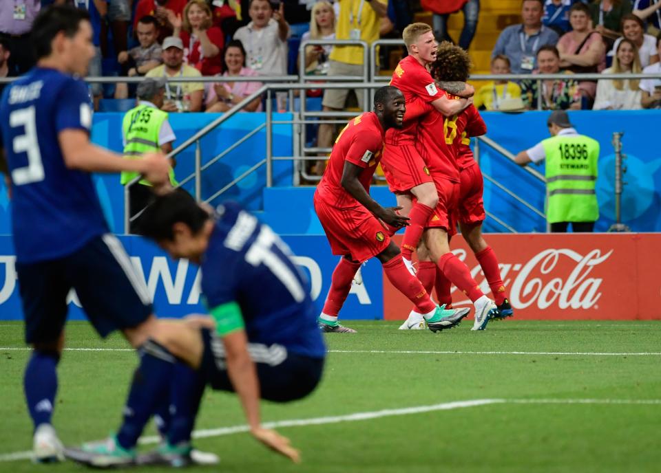 <p>Belgium’s midfielder Marouane Fellaini (R) celebrates with Belgium’s midfielder Kevin De Bruyne (2R) and Belgium’s forward Romelu Lukaku (3R) after scoring their second goal during the Russia 2018 World Cup round of 16 football match between Belgium and Japan at the Rostov Arena in Rostov-On-Don on July 2, 2018. (Photo by PIERRE-PHILIPPE MARCOU / AFP) </p>