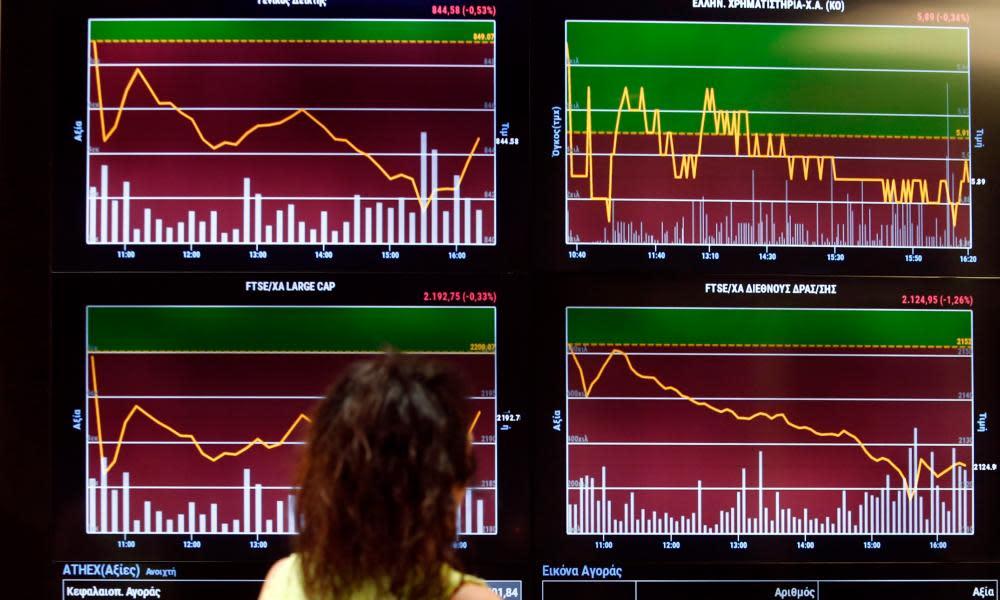 Stock prices on a screen at the Athens Stock Exchange