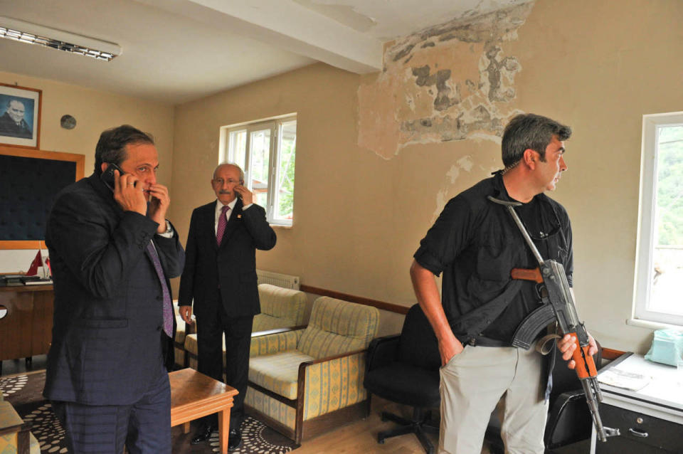 Turkey’s main opposition Republican People’s Party (CHP) leader Kilicdaroglu speaks on his mobile phone after an attack