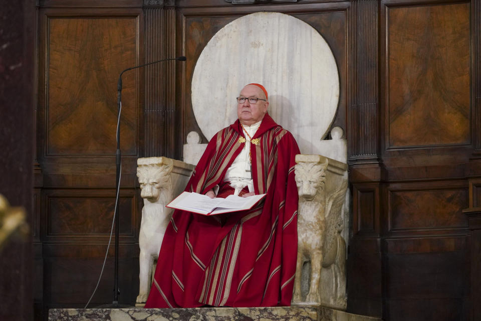 US Cardinal Kevin Joseph Farrell presides over a vigil service over the death of George Floyd, a black man who died after being restrained by Minneapolis police officers on May 25, in Rome's Santa Maria in Trastevere Church, Friday, June 5, 2020. Cardinal Farrell says the killing of George Floyd has laid bare that the Christian principles of the U.S. Constitution aren’t being applied to blacks, and is evidence that divisive, demonizing language can kill. (AP Photo/Andrew Medichini)