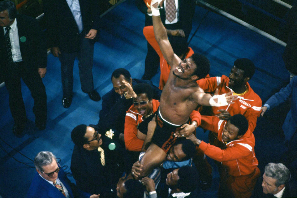 FILE - In this Feb. 15, 1978, file photo, Leon Spinks celebrates as his entourage holds him aloft after his 15-round split decision victory over world heavyweight boxing champion Muhammad Ali in Las Vegas. Former heavyweight champion Leon Spinks Jr. died Friday night, Feb. 5, 2021, after battling prostate and other cancers. He was 67. (AP Photo/FIle)