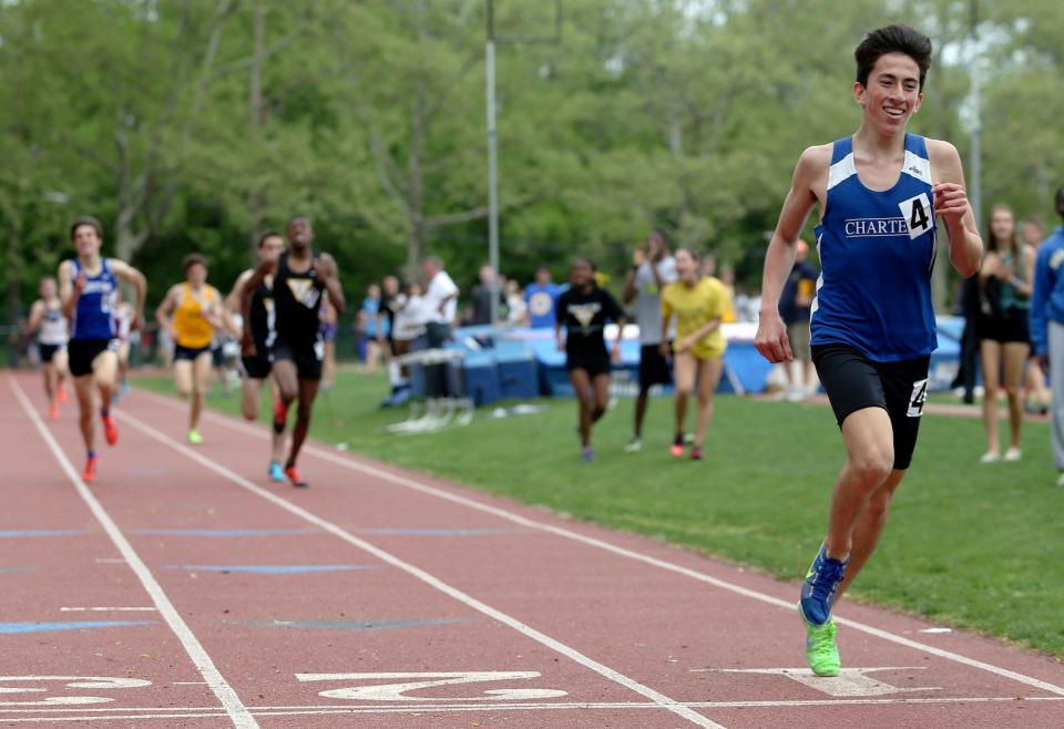 Charter of Wilmington's Kieran Tuntivate is shown leaving the pack behind to win the 1600-meter run at the 2014 New Castle County Track and Field Championships at Baynard Stadium. He won the event again the following year in a state-record time of 4:11.71.