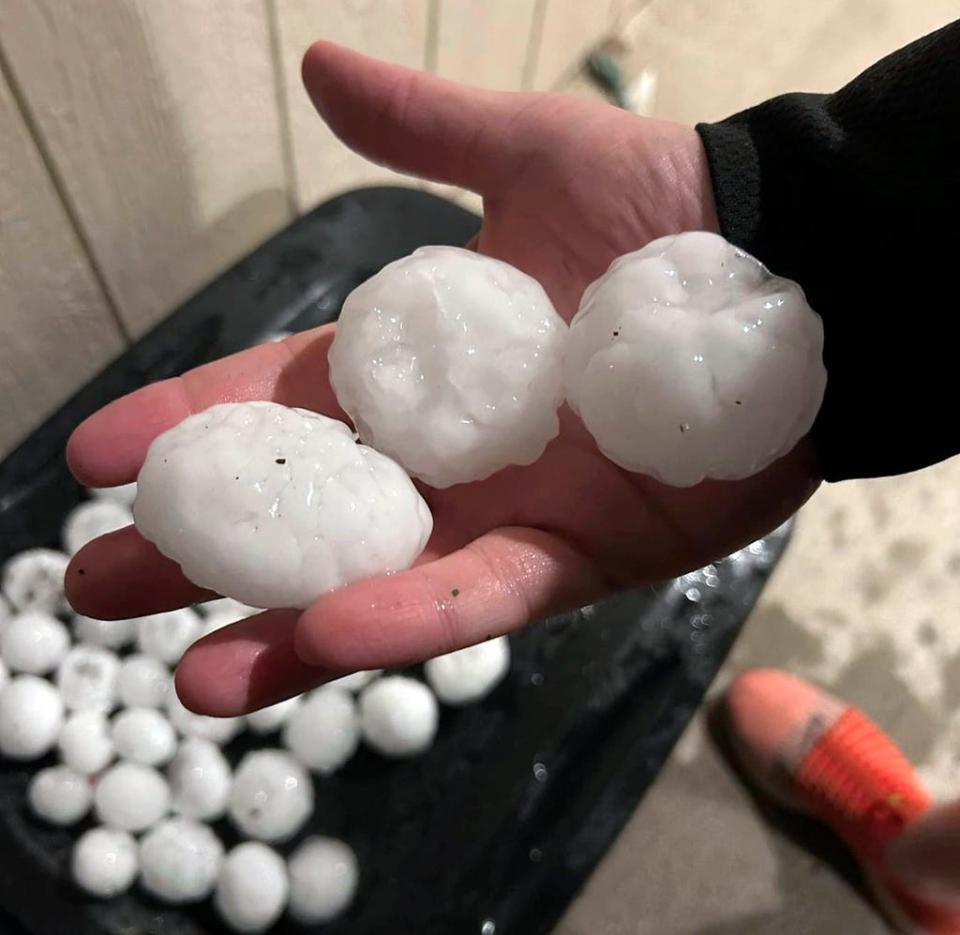 In this image provided by Jeremy Crabtree, large chunks of hail are shown March 13, 2024, in Shawnee, Kan.