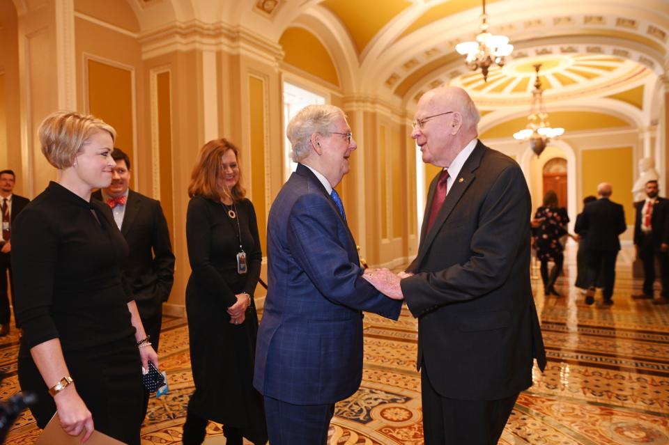 U.S. Sen. Mitch McConnell, R-Kentucky, greets U.S. Sen. Patrick Leahy, outside the  Senate Chamber before the swearing in ceremony for the 118th Congress at the Capitol in Washington, D.C. on Tuesday, January 3, 2023. Sen. McConnell is now the longest-serving party leader in history. Leahy prides himself on seeking to work closely with members of all political parties. Retiring after 48 years of service, Senator Leahy is the third-longest-serving senator in U.S. history.