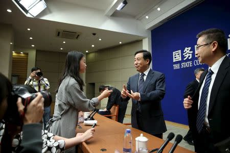 Xu Dazhe, head of China National Space Administration talks to journalists after a news conference in Beijing, China, April 22, 2016. China Daily/via REUTERS