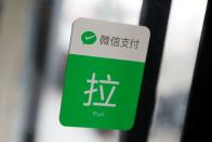 The logo of the digital payment service WeChat Pay is seen at a shop, in Beijing