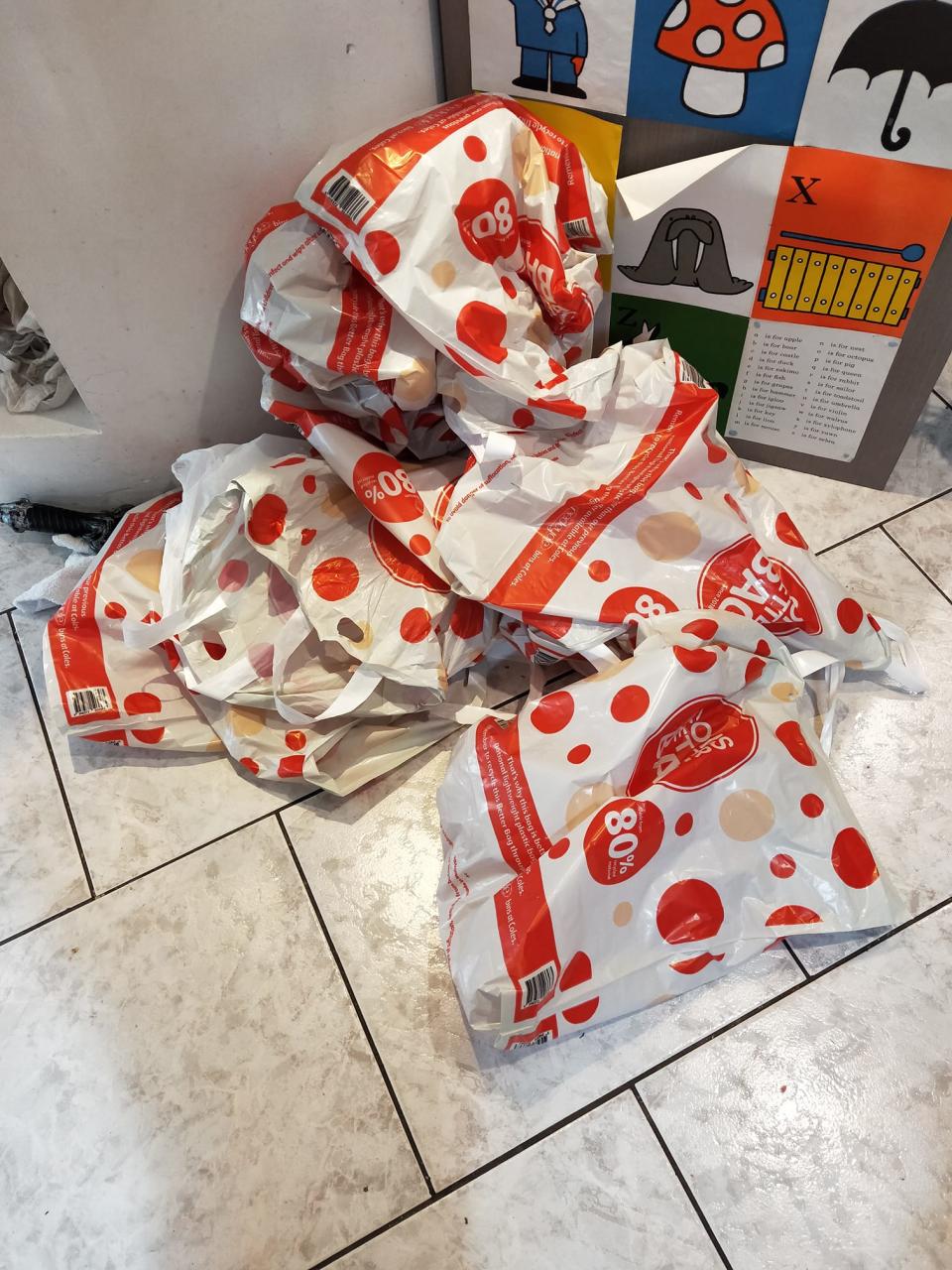 Pictured is a pile of Coles plastic bags that were part of a shopper's Click and Collect order. 