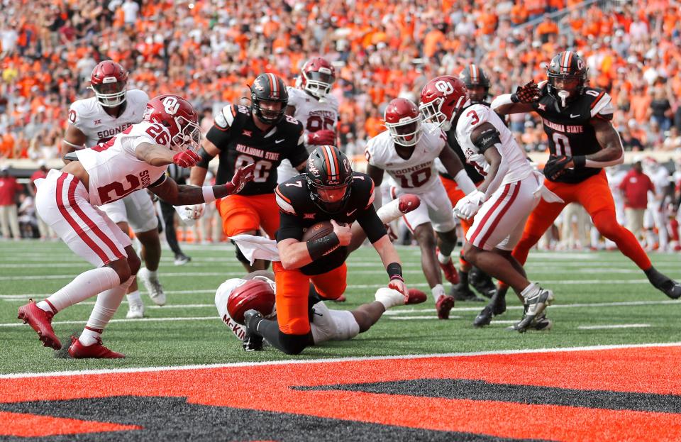 OSU quarterback Alan Bowman (7) scores a touchdown in the first half of a 27-24 win against OU in Bedlam on Saturday at Boone Pickens Stadium in Stillwater.