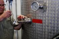 Herman Mihalich samples some of the company's bottle-ready whisky in their distillery in Bristol Pennsylvania