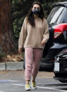 <p>Mila Kunis keeps things cozy as she runs errands in Beverly Hills on Dec. 27. </p>