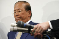 Toshiro Muto, CEO of the Tokyo 2020 Organizing Committee, listens to reporters' questions during a news conference in Tokyo Tuesday, March 17, 2020. Tokyo Olympic organizers are pushing ahead with the Japanese leg of the torch relay that opens on March 26 despite the threat of the spreading coronavirus. Muto said that crowds will not be prohibited from gathering on the roadside. But he asked for restraint and warned the relay could be stopped or delayed. (AP Photo/Eugene Hoshiko)