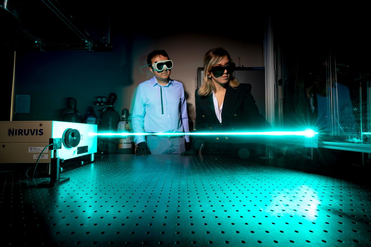 Ciprian Dumitrache, an assistant professor in mechanical engineering, works with doctoral student Mozhdeh Hooshyar in the laser laboratory at the Colorado State University Energy Institute in Fort Collins on April 19, 2023.