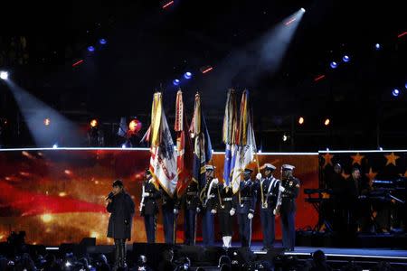 Singer Jennifer Hudson performs the U.S. National Anthem in front of a military color guard during The Concert for Valor on the National Mall on Veterans' Day in Washington, November 11, 2014. REUTERS/Gary Cameron