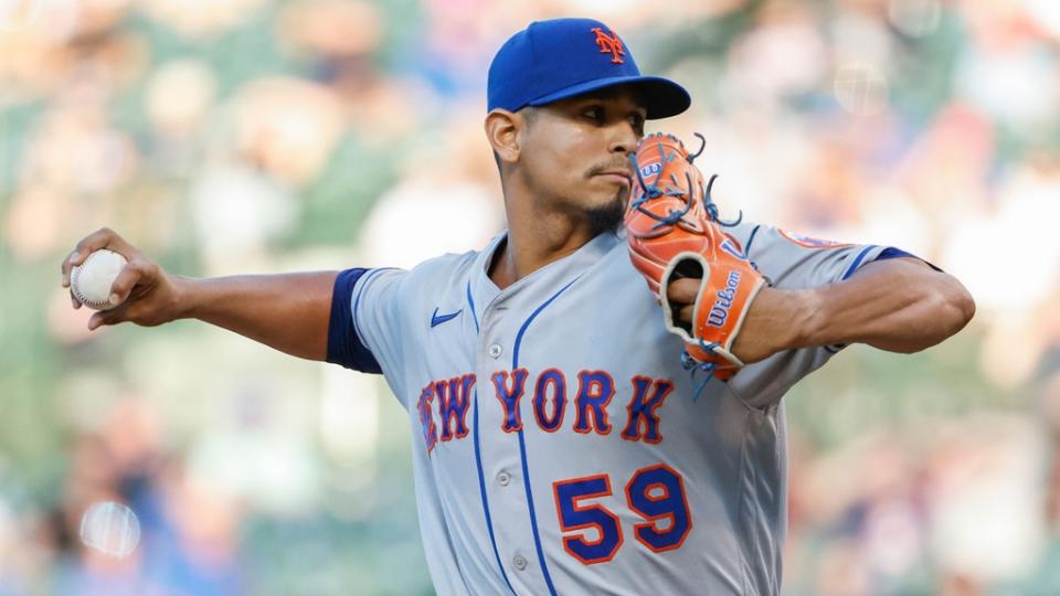 Jul 14, 2022; Chicago, Illinois, USA; New York Mets starting pitcher Carlos Carrasco (59) delivers against the Chicago Cubs during the first inning at Wrigley Field.