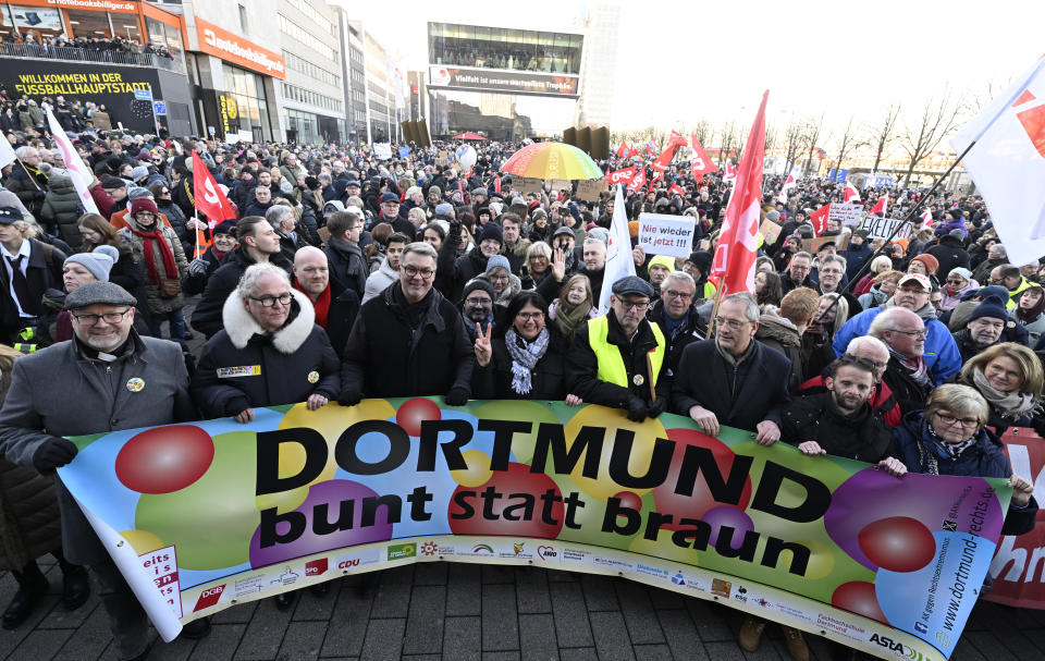 People gather at the train station in Dortmund, Germany, Saturday Jan. 20, 2024, as part of nationwide demonstrations against right-wing extremism. (Roberto Pfeil/dpa via AP)
