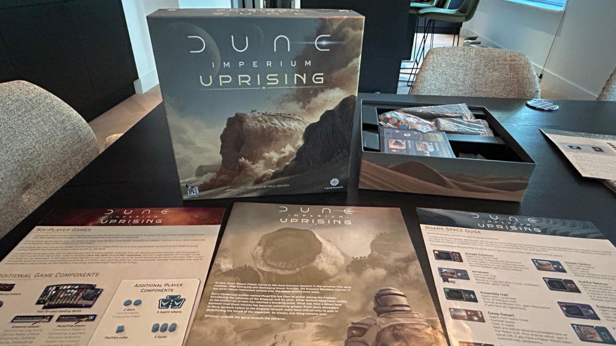  Dune: Imperium - Uprising box and contents laid out on a table. 