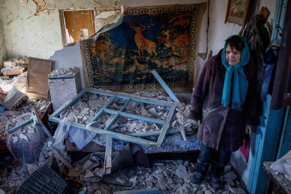 Tetiana, 67, stands in her house, which was destroyed by a Russian missile strike near Kyiv (Reuters)