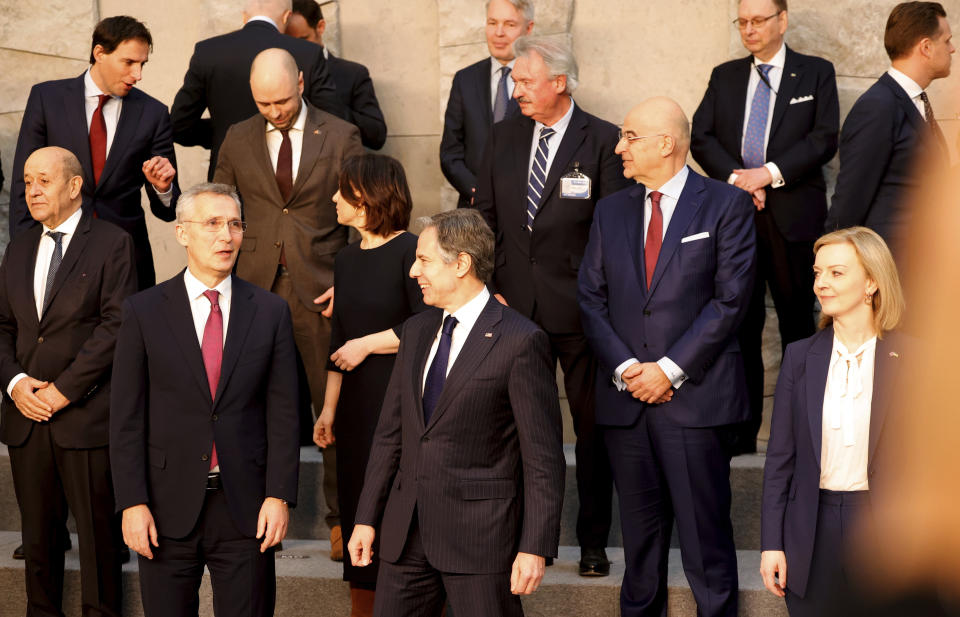 NATO Secretary General Jens Stoltenberg, front left, speaks with U.S. Secretary of State Antony Blinken, front center, as they take part in a group photo at an extraordinary NATO foreign ministers meeting at NATO headquarters in Brussels, Friday, March 4, 2022. U.S. Secretary of State Antony Blinken meets Friday with his counterparts from NATO and the European Union, as Russia's war on Ukraine entered its ninth day marked by the seizure of the strategic port city of Kherson and the shelling of Europe's largest nuclear power plant. (AP Photo/Olivier Matthys)