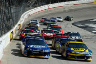 BRISTOL, TN - MARCH 18: Brad Keselowski, driver of the #2 Miller Lite Dodge, and Matt Kenseth, driver of the #17 Best Buy Ford, lead the field to a restart during the NASCAR Sprint Cup Series Food City 500 at Bristol Motor Speedway on March 18, 2012 in Bristol, Tennessee. (Photo by Jared C. Tilton/Getty Images)