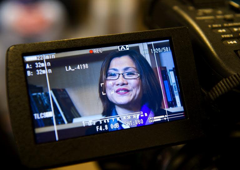 Shandra Woworuntu, human trafficking survivor and activist, is seen on a camera monitor during an interview with AFP, at Humanity United in Washington, DC, on January 28, 2014