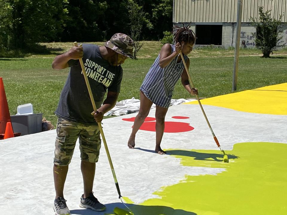 Vitus Shell and Jennifer Haynes are among the members of the Black Creative Circle who are participating in painting the mural.