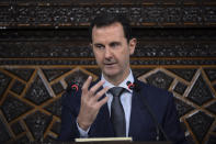 FILE - In this June 7, 2016 file photo released by the Syrian official news agency SANA, Syrian President Bashar Assad, addresses a speech to the newly-elected parliament at the parliament building, in Damascus, Syria. Assad's government came under mounting international pressure Thursday, April 6, 2017 after a chemical attack in northern Syria, with even key ally Russia saying its support is not unconditional. (SANA via AP)