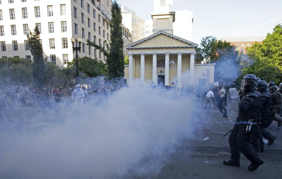 <span class="caption">Police officers push back demonstrators next to St. John's Episcopal Church outside of the White House, June 1, 2020 in Washington D.C.</span> <span class="attribution"><a class="link " href="https://www.gettyimages.com/detail/news-photo/police-officers-wearing-riot-gear-push-back-demonstrators-news-photo/1216832807?adppopup=true" rel="nofollow noopener" target="_blank" data-ylk="slk:Jose Luis Magana/AFP via Getty Images;elm:context_link;itc:0;sec:content-canvas">Jose Luis Magana/AFP via Getty Images</a></span>