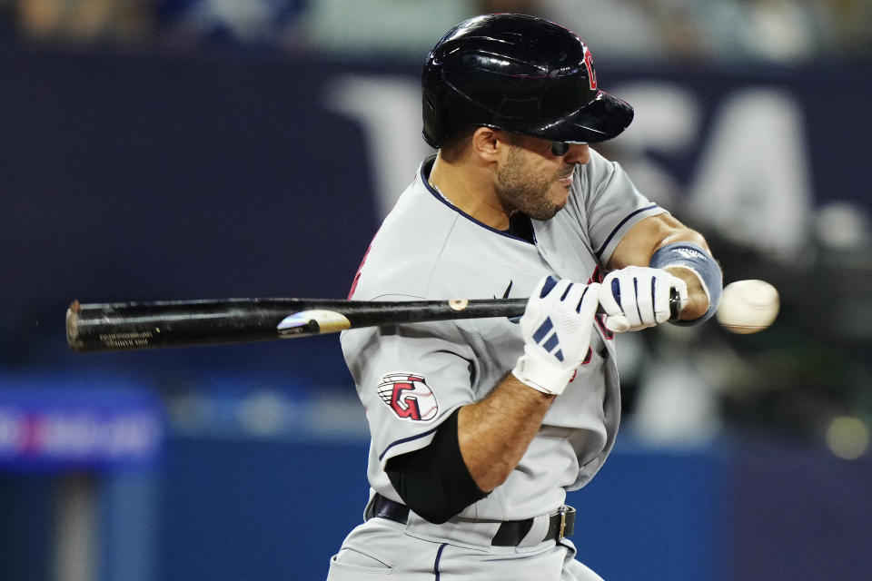 Cleveland Guardians' Ramon Laureano is hit by a pitch from Toronto Blue Jays relief pitcher Yimi Garcia during sixth-inning baseball game action in Toronto, Saturday, Aug. 26, 2023. (Frank Gunn/The Canadian Press via AP)