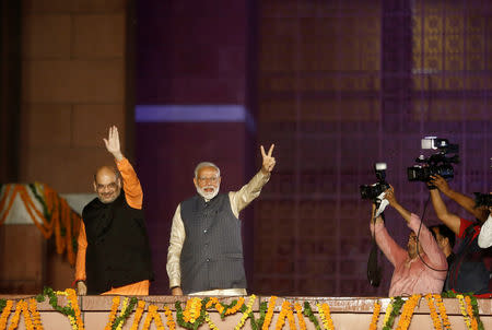 BJP President Amit Shah and Indian Prime Minister Narendra Modi gesture after the election results in New Delhi, India, May 23, 2019. REUTERS/Adnan Abidi