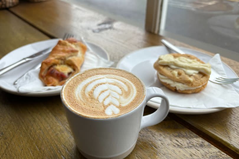 My flat white, bacon and cheese twist and Milkybar cookie sandwich from Market West