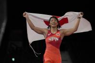 Japan's Risako Kawai celebrates after winning the gold medal defeating Belarus's Iryna Kurachkina during the women's 57kg Freestyle wrestling final match, at the 2020 Summer Olympics, Thursday, Aug. 5, 2021, in Tokyo, Japan. (AP Photo/Aaron Favila)