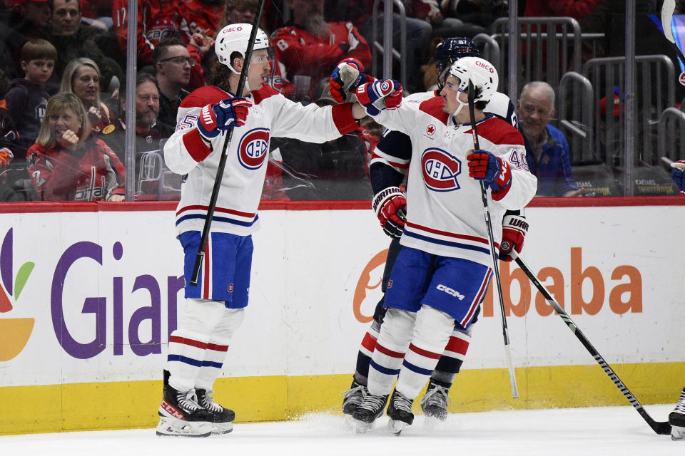 Montreal Canadiens left wing Michael Pezzetta (55) celebrates his goal with left wing Rafael Harvey-Pinard (49) during the first period of an NHL hockey game against the Washington Capitals, Tuesday, Feb. 6, 2024, in Washington. (AP Photo/Nick Wass)