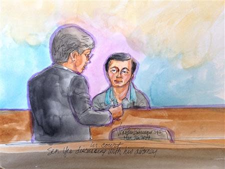 California state senator Leland Yee (R) appears in this courtroom sketch speaking with his attorney in San Francisco March 26, 2014. REUTERS/Vicki Behringer