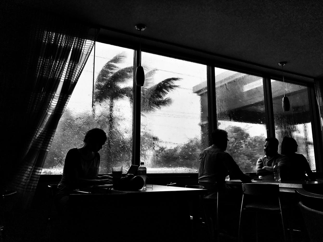 Guests sat in the lobby of the Fairfield Inn and Suites in Miami on Sept. 10 as the area was hit by 100 mph wind gusts from Hurricane Irma. (Photo: Holly Bailey/Yahoo News)