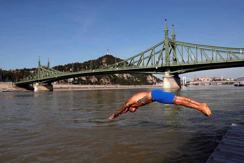 Participants swim across the Danube River during the Budapest Urban Games in Budapest