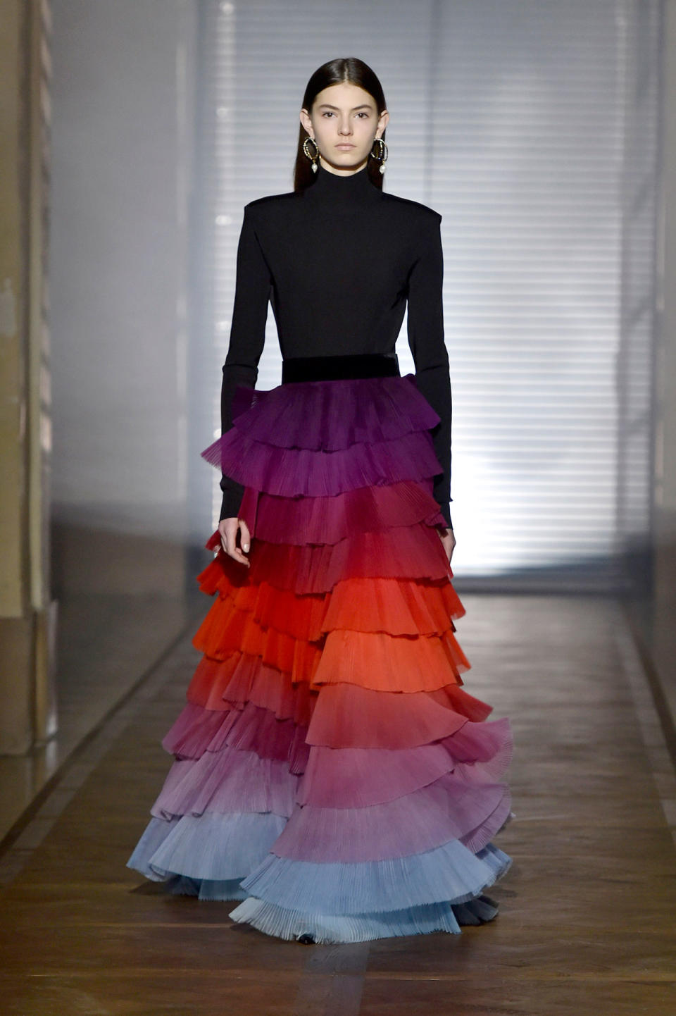 <p>Model wears a black turtleneck and multi-colored tier skirt from the Givenchy SS18 Haute Couture show. (Photo: Getty Images) </p>