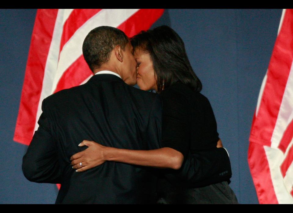 CHICAGO - NOVEMBER 04:  U.S. President elect Barack Obama kisses his wife Michelle as they walk off the stage after Obama gave his victory speech during an election night gathering in Grant Park on November 4, 2008 in Chicago, Illinois. Obama defeated Republican nominee Sen. John McCain (R-AZ) by a wide margin in the election to become the first African-American U.S. President elect.  (Photo by Scott Olson/Getty Images)