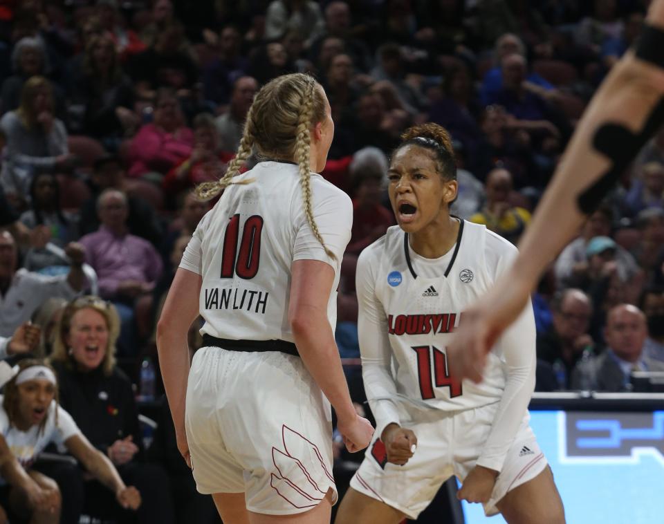 Louisville’s Kianna Smith celebrates with Hailey Van Lith after she made a bucket against Michigan.March 28, 2022