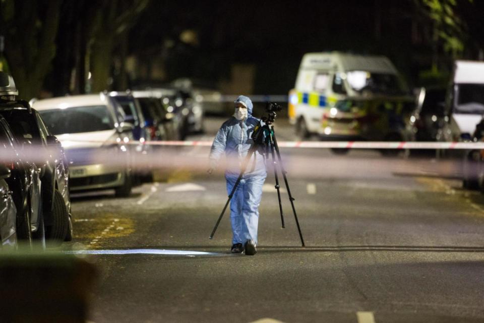 Crime scene: a forensics officer investigates the killing of an 18-year-old, named as Sami Sidhom, in Chestnut Avenue, Forest Gate today. Friends called him an “A-star pupil” ( SWNS)