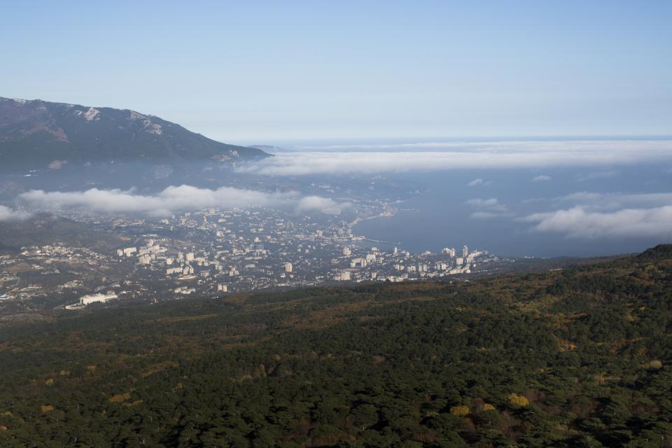 FILE In this file photo taken on Thursday, Nov. 20, 2014, a view of Yalta from the Ai-Petri is a peak in the Crimean Mountains. The European Court of Human Rights decided Thursday Jan. 14, 2021, to start considering Ukraine's complaint against alleged human rights violations in the Russia-annexed Crimea. (AP Photo/Alexander Zemlianichenko, File)