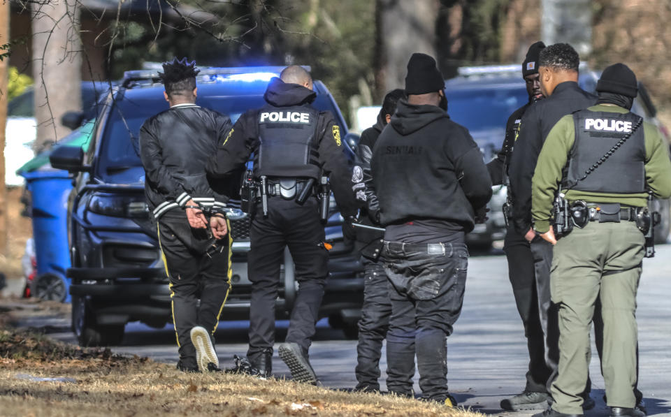 Multiple people are in custody after a shots fired call expedited a suspected trafficking investigation at a home in South Fulton, Ga., Thursday morning, Feb. 1, 2024. Police in an Atlanta-area city responding to shots fired at a home on Thursday found numerous women there and are investigating the possibility the residence was used for sex trafficking, authorities said. (John Spink/Atlanta Journal-Constitution via AP)