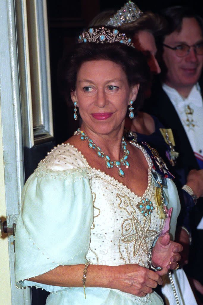 <p>Margaret wears a lavish gown and coordinated jewels to the Portuguese embassy in London in 1993.</p>