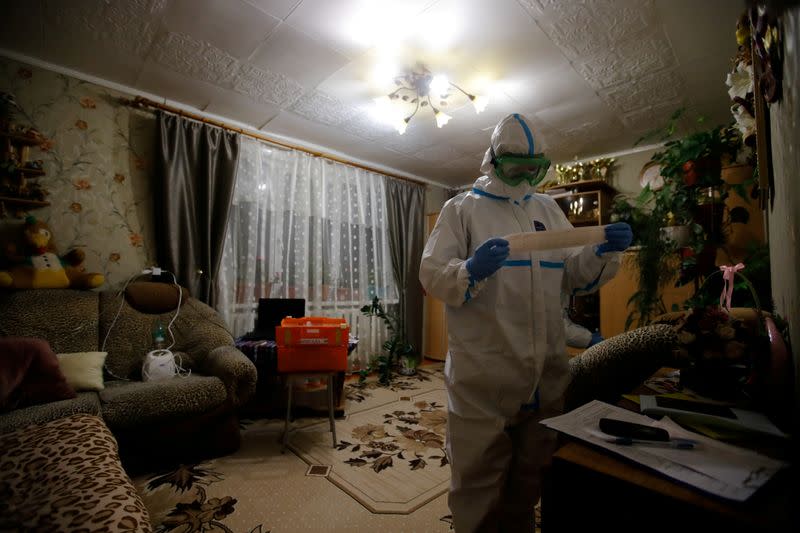 FILE PHOTO: Paramedics visit patients at home amid coronavirus disease (COVID-19) outbreak in Novgorod Region