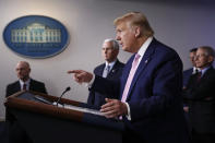 President Donald Trump speaks during a coronavirus task force briefing at the White House, Saturday, April 4, 2020, in Washington. Standing alongside are Food and Drug Administration Commissioner Dr. Stephen Hahn, from back left, Vice President Mike Pence and Dr. Anthony Fauci, director of the National Institute of Allergy and Infectious Diseases. (AP Photo/Patrick Semansky)