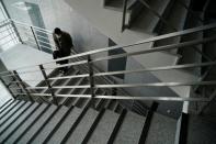 A professor of Pusan National University Park Hyun who used to be a coronavirus patient, takes a deep breath while walking up the stairs at Pusan National University in Busan