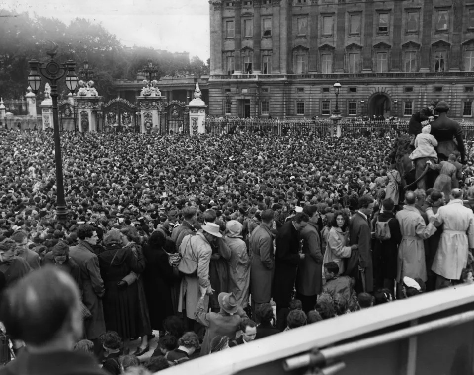 2nd June 1953:  Vast crowds congregate outside Buckingham Palace, awaiting the appearance on the balcony of HM The Queen Elizabeth II and her family following the Coronation.  (Photo by Reg Birkett/Keystone/Getty Images)