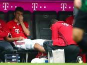 Football Soccer - Bayern Munich v Augsburg - German Bundesliga - Allianz Arena, Munich, Germany - 01/04/17 - Bayern Munich's Thomas Mueller receives medical assistance after he got injured. REUTERS/Michael Dalder